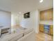 Finished basement with a mini bar, storage cabinets and a TV at 8039 Mcconnell Rd, Denver, NC 28037
