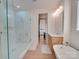 Bright bathroom with a glass shower, soaking tub, and wood-look floors at 8039 Mcconnell Rd, Denver, NC 28037