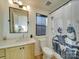 Stylish bathroom with a modern vanity, sleek fixtures, and a fun shower curtain for added personality at 8039 Mcconnell Rd, Denver, NC 28037