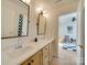 Bathroom featuring double sinks, quartz countertops and wooden cabinets at 8039 Mcconnell Rd, Denver, NC 28037