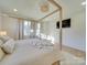 Bright bedroom with a four poster bed, wooden floors and natural light at 8039 Mcconnell Rd, Denver, NC 28037