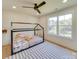 Bright bedroom featuring a bed with canopy frame, natural light, and a ceiling fan at 8039 Mcconnell Rd, Denver, NC 28037
