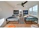 Fun bedroom featuring two beds, playful decor, and a light, airy feel with bright natural light at 8039 Mcconnell Rd, Denver, NC 28037