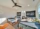 Bright bedroom featuring two twin beds, a ceiling fan, and large windows for ample natural light at 8039 Mcconnell Rd, Denver, NC 28037