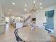 Open concept kitchen with stainless steel appliances, a large island, and seamless transition to the living space at 8039 Mcconnell Rd, Denver, NC 28037