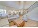 Bright open floor plan featuring a living room, stairs, and kitchen at 8039 Mcconnell Rd, Denver, NC 28037