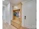 Mudroom with custom built-in storage, bench seating, and coat hooks, offering practical organization at 8039 Mcconnell Rd, Denver, NC 28037