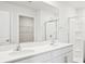 Bathroom showcasing a double vanity, sleek fixtures, and a glass-enclosed shower at 108 Rustling Waters Dr, Mooresville, NC 28117