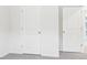 Walk-in closet with bright white walls and new carpeting perfect for storage at 108 Rustling Waters Dr, Mooresville, NC 28117