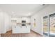 Modern kitchen featuring white cabinets, stainless steel appliances, and a center island at 108 Rustling Waters Dr, Mooresville, NC 28117