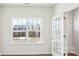 Bright room with a large window and french doors, creating a spacious feel at 108 Rustling Waters Dr, Mooresville, NC 28117