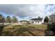 Large backyard with grassy area and a fire pit at 1274 Bicycle Ct, York, SC 29745