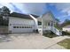 White one-story house with a two-car garage and a partially visible driveway at 1274 Bicycle Ct, York, SC 29745