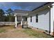 White house side with a porch and a partially visible yard at 1274 Bicycle Ct, York, SC 29745