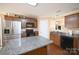 Spacious kitchen with an island, granite countertops, and stainless steel appliances at 1274 Bicycle Ct, York, SC 29745