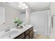 Bathroom with double vanity, shower, and white curtain at 188 Water Ski Dr, Statesville, NC 28677