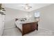 Bright bedroom with double bed, ceiling fan, and window coverings at 188 Water Ski Dr, Statesville, NC 28677