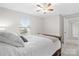 Bedroom with double bed, ceiling fan, and access to hallway at 188 Water Ski Dr, Statesville, NC 28677