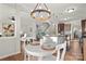 Bright dining area with white table and chairs, open to kitchen at 188 Water Ski Dr, Statesville, NC 28677