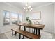 Dining room features a rustic wood table and a chandelier at 188 Water Ski Dr, Statesville, NC 28677