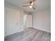 Light and airy bedroom with neutral walls and hardwood floors at 221 Palmer St, Albemarle, NC 28001