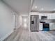 Stainless steel appliances and white cabinets highlight this galley kitchen at 221 Palmer St, Albemarle, NC 28001