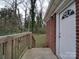 Wooden deck and steps leading to a grassy backyard at 2996 Shady Ln, Charlotte, NC 28208