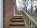 Brick steps leading to a backyard with trees at 2996 Shady Ln, Charlotte, NC 28208