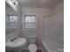 Clean bathroom with a tub, sink, and toilet at 2996 Shady Ln, Charlotte, NC 28208