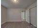 Simple bedroom with hardwood floors and ample closet space at 2996 Shady Ln, Charlotte, NC 28208