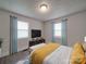 Bright bedroom with a bed, TV, and window coverings at 2996 Shady Ln, Charlotte, NC 28208