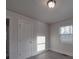 Charming bedroom with wood-look floors and window at 2996 Shady Ln, Charlotte, NC 28208