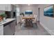 Kitchen dining area with a wooden table and four chairs at 2996 Shady Ln, Charlotte, NC 28208