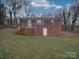 Brick house with a back deck and yard at 2996 Shady Ln, Charlotte, NC 28208