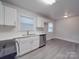 Modern kitchen with white cabinets and stainless steel appliances at 2996 Shady Ln, Charlotte, NC 28208