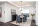 Cozy dining room with a tray ceiling, dark wood floors, and seating for six at 3013 Old Glory Dr # 24, Gastonia, NC 28056