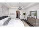 Spacious main bedroom with tray ceiling, chandelier, dark wood floors, and marble accent wall at 3013 Old Glory Dr # 24, Gastonia, NC 28056