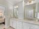 Elegant bathroom with double vanity, granite countertop, and white cabinets at 3364 Northampton Dr, Charlotte, NC 28210