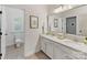 Bathroom with toilet and sink vanity, and access to another room at 3364 Northampton Dr, Charlotte, NC 28210