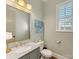 Light and airy powder room with granite vanity and window at 3364 Northampton Dr, Charlotte, NC 28210