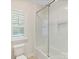 Bathroom with shower/tub combo and window with shutters at 3364 Northampton Dr, Charlotte, NC 28210