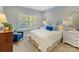 Bright bedroom with a queen-size bed and window shutters at 3364 Northampton Dr, Charlotte, NC 28210