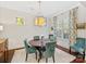 Well-lit dining room with round table and comfortable seating at 3364 Northampton Dr, Charlotte, NC 28210