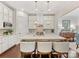 Modern kitchen with white cabinets, granite counters and island at 3364 Northampton Dr, Charlotte, NC 28210