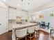 Spacious kitchen with island, stainless steel appliances, and white cabinets at 3364 Northampton Dr, Charlotte, NC 28210