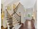 Modern staircase with wrought iron railing and hardwood floors at 3364 Northampton Dr, Charlotte, NC 28210