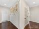 Upper hallway with hardwood floors and framed photos on the wall at 3364 Northampton Dr, Charlotte, NC 28210