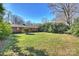 Spacious backyard with a large grassy area at 4017 Sulkirk Rd, Charlotte, NC 28210