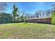 Large backyard with grassy area and patio at 4017 Sulkirk Rd, Charlotte, NC 28210