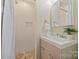 Clean bathroom, featuring a walk-in shower and updated vanity at 4017 Sulkirk Rd, Charlotte, NC 28210